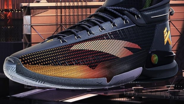Side view of Klay Thompson's black and gold ANTA basketball shoe.